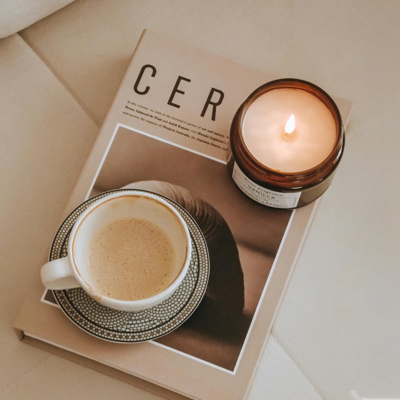 coffee and candle on a book